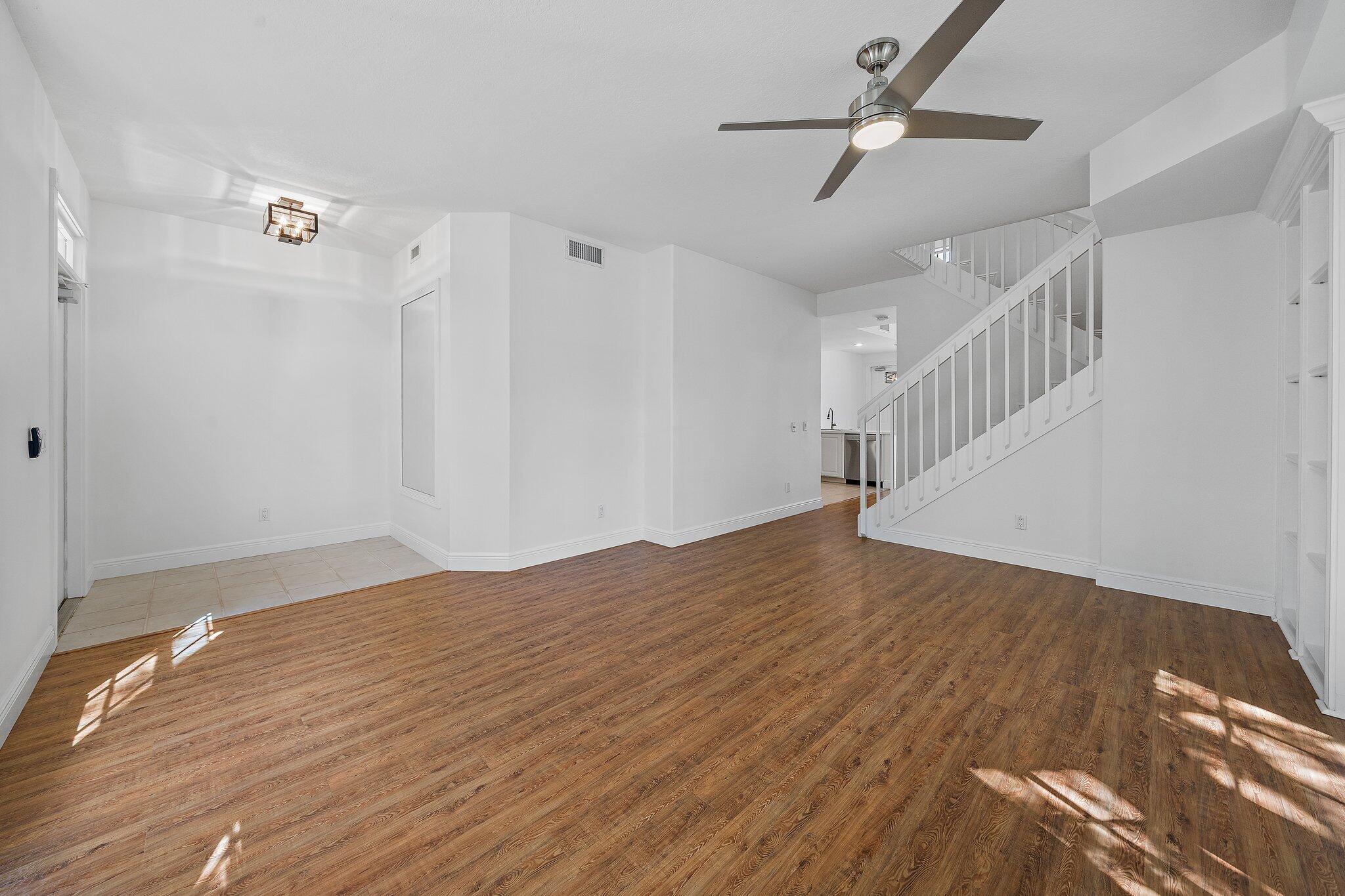 304 Legare Court Jupiter, FL 33458 - Photo 4 of 38 a view of empty room with wooden floor