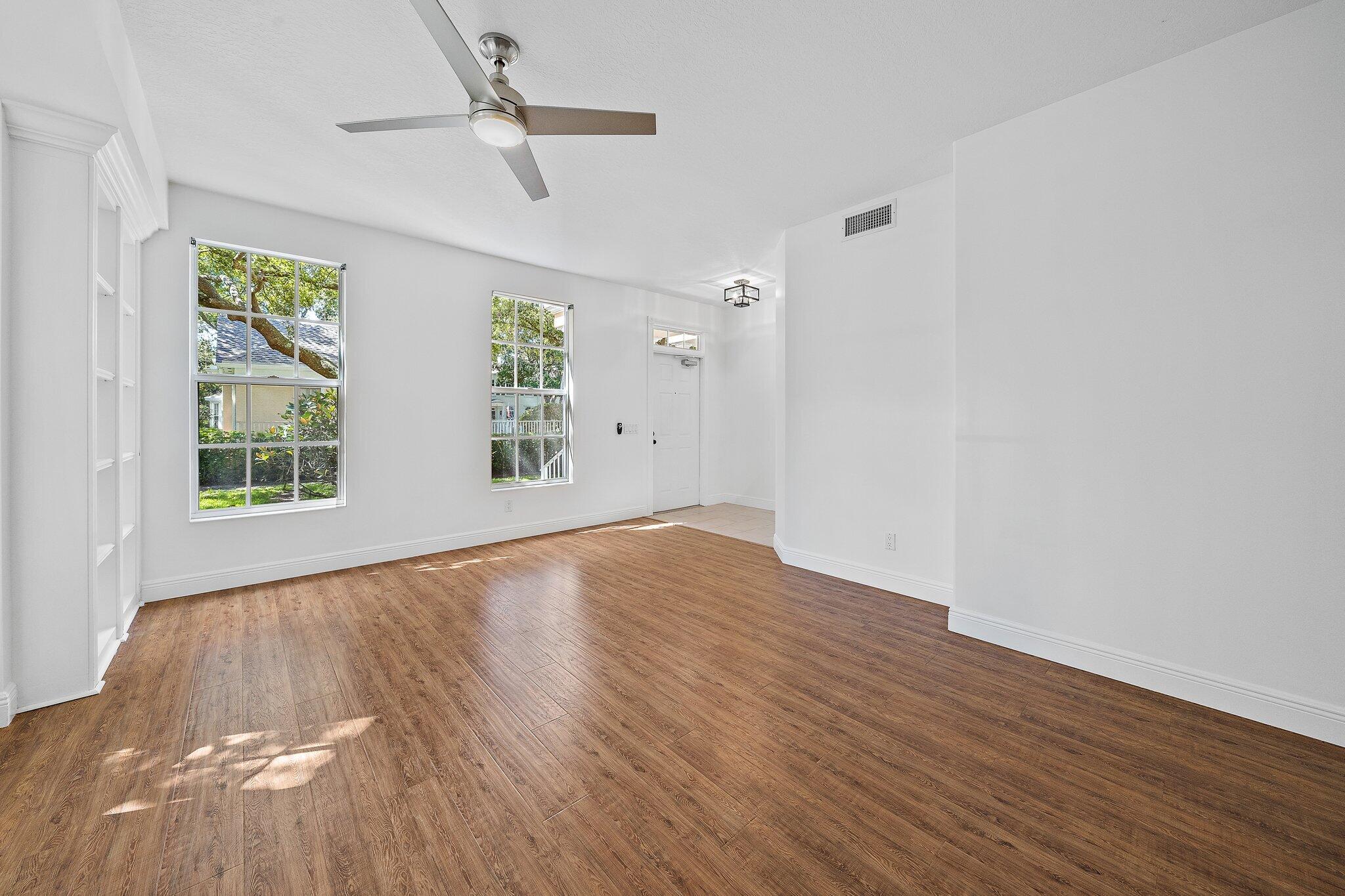304 Legare Court Jupiter, FL 33458 - Photo 5 of 38 wooden floor in an empty room with a window