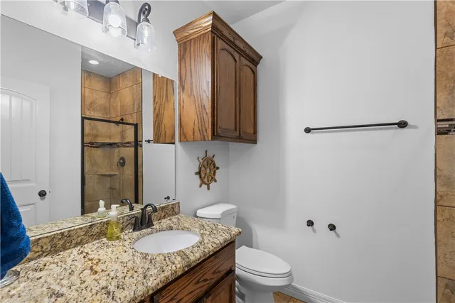 a bed in a room next to a lamp