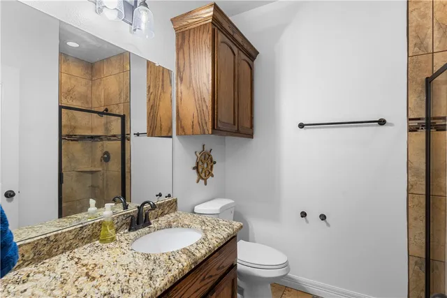 a bedroom with furniture and a flat screen tv