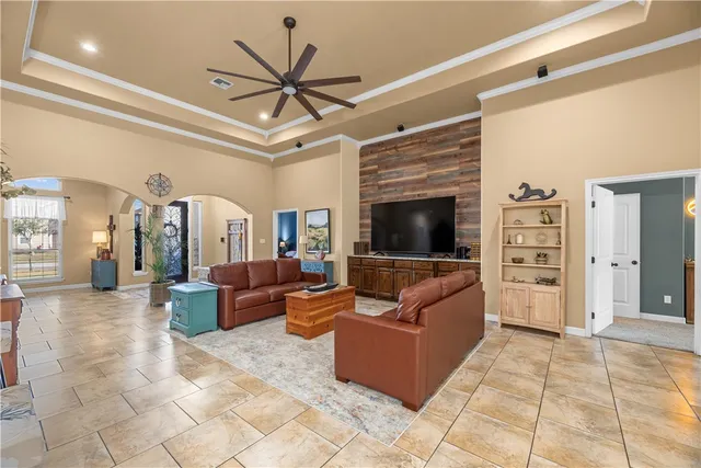 a view of a bedroom with window and wooden floor
