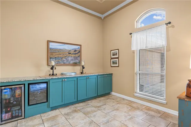 a kitchen with stainless steel appliances granite countertop a stove and cabinets