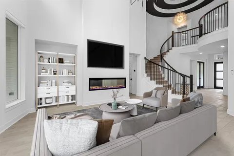 a living room with furniture and kitchen view