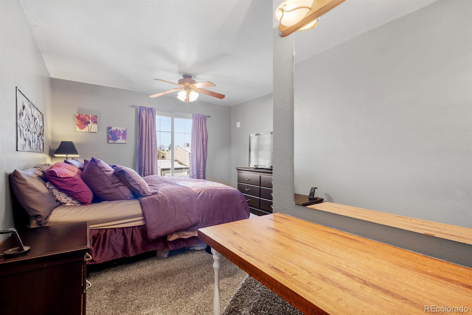 4262 South Quintero Way Aurora, CO 80013 - Photo 13 of 36 a bedroom with bed and a window