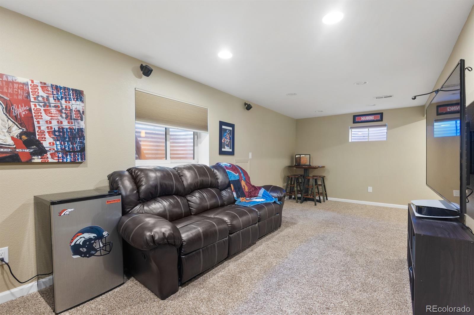 4262 South Quintero Way Aurora, CO 80013 - Photo 26 of 36 a living room with furniture and a flat screen tv