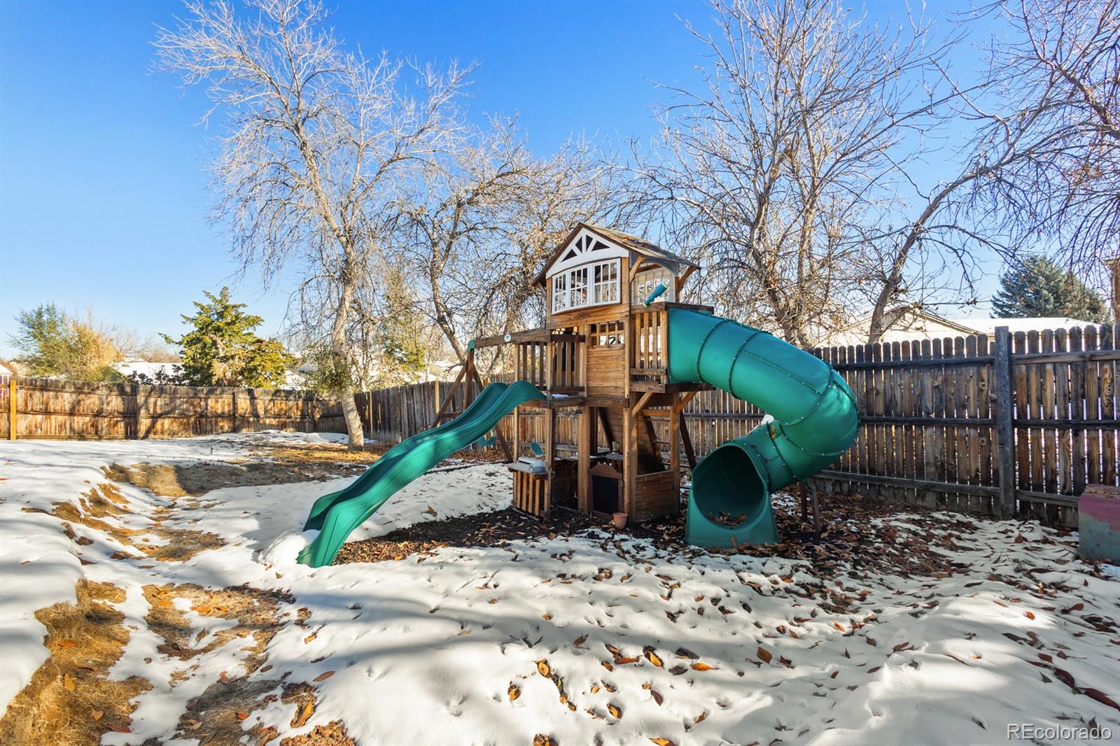 4262 South Quintero Way Aurora, CO 80013 - Photo 29 of 36 a view of a chair and table in the backyard