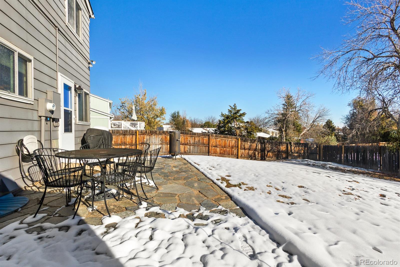 4262 South Quintero Way Aurora, CO 80013 - Photo 31 of 36 a view of a patio with a yard