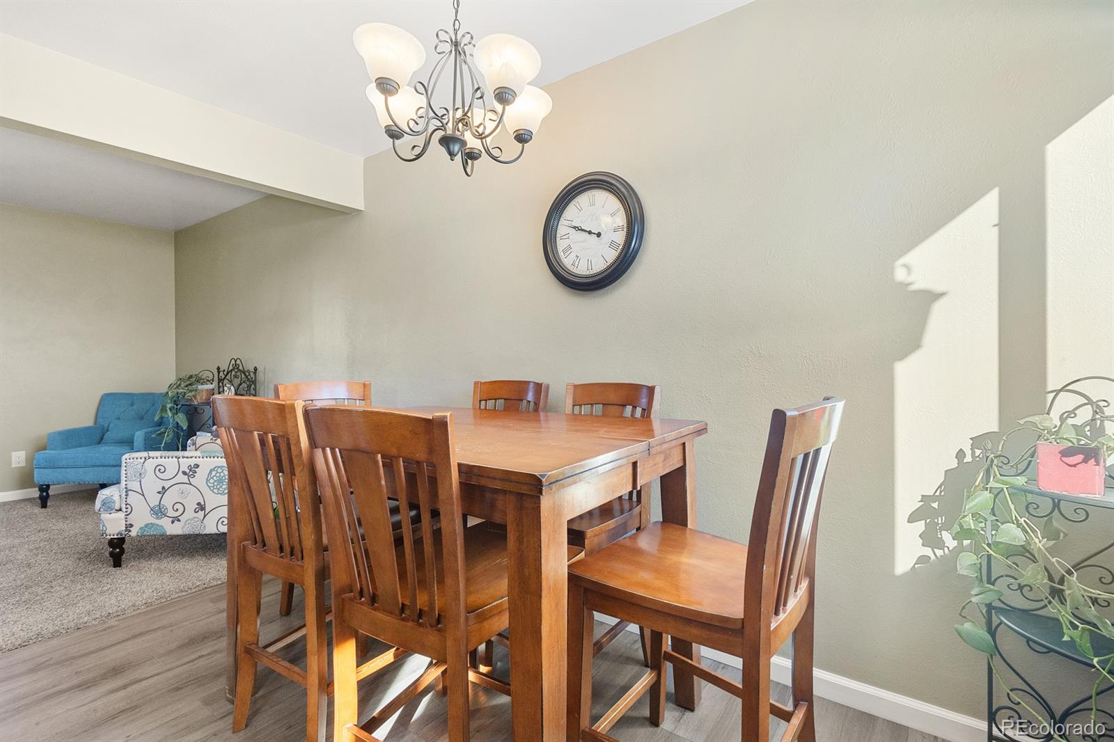 4262 South Quintero Way Aurora, CO 80013 - Photo 6 of 36 a view of a dining room with furniture and chandelier