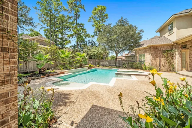a view of a swimming pool with an outdoor space
