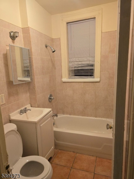 135 40th Street, Unit 104 Union City, NJ 07087 - Photo 3 of 4 a bathroom with a sink toilet and shower