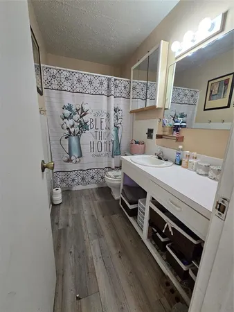 a kitchen with a stove and white cabinets