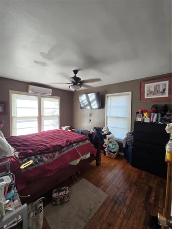 a bed room with furniture and a window