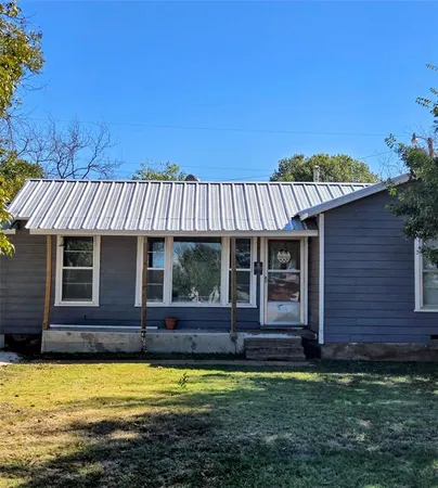 a view of a house with swimming pool and porch with furniture