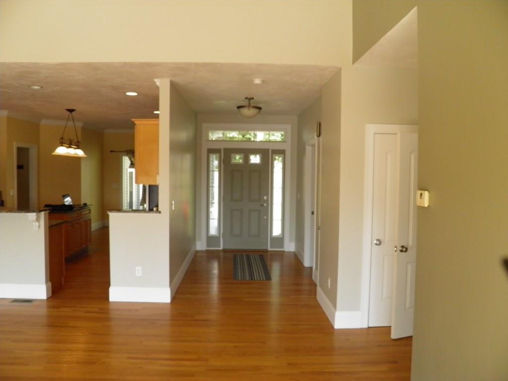 115 Fisherdick Road Ware, MA 01082 - Photo 14 of 30 a view of a hallway with wooden floor and a bathroom