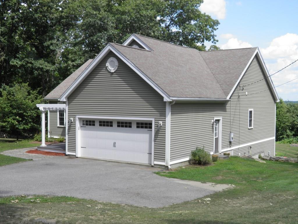 115 Fisherdick Road Ware, MA 01082 - Photo 2 of 30 a view of house with a yard and garage