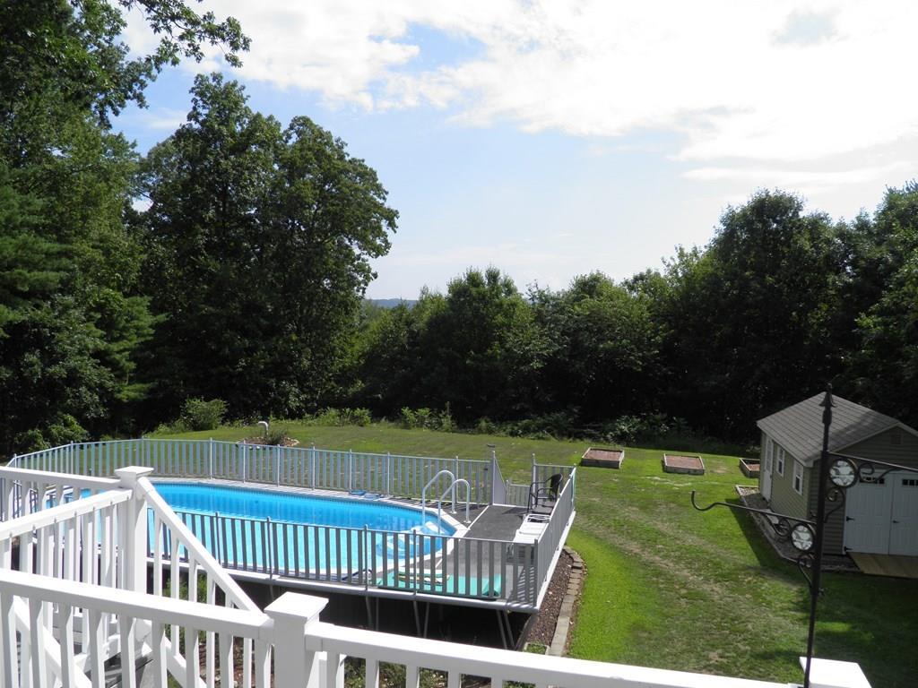 115 Fisherdick Road Ware, MA 01082 - Photo 25 of 30 a view of a wooden deck and a big yard