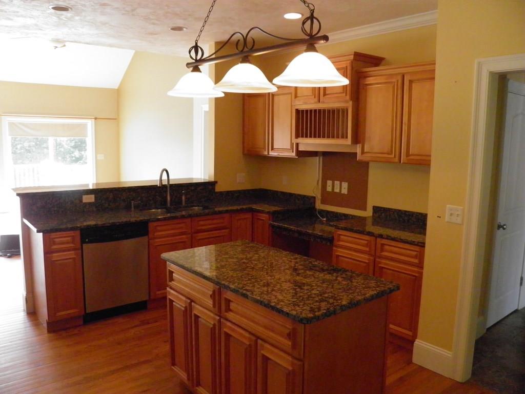 115 Fisherdick Road Ware, MA 01082 - Photo 29 of 30 a kitchen with stainless steel appliances granite countertop a sink and a microwave