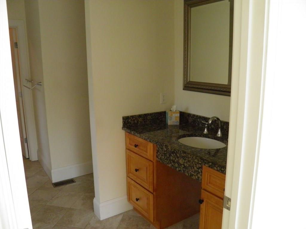 115 Fisherdick Road Ware, MA 01082 - Photo 4 of 30 a bathroom with a granite countertop sink and a mirror