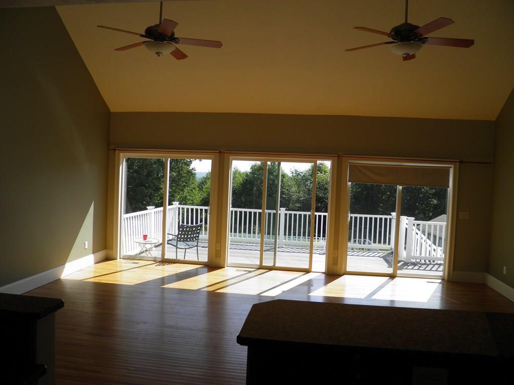 115 Fisherdick Road Ware, MA 01082 - Photo 7 of 30 a view of balcony with a floor to ceiling window and wooden floor