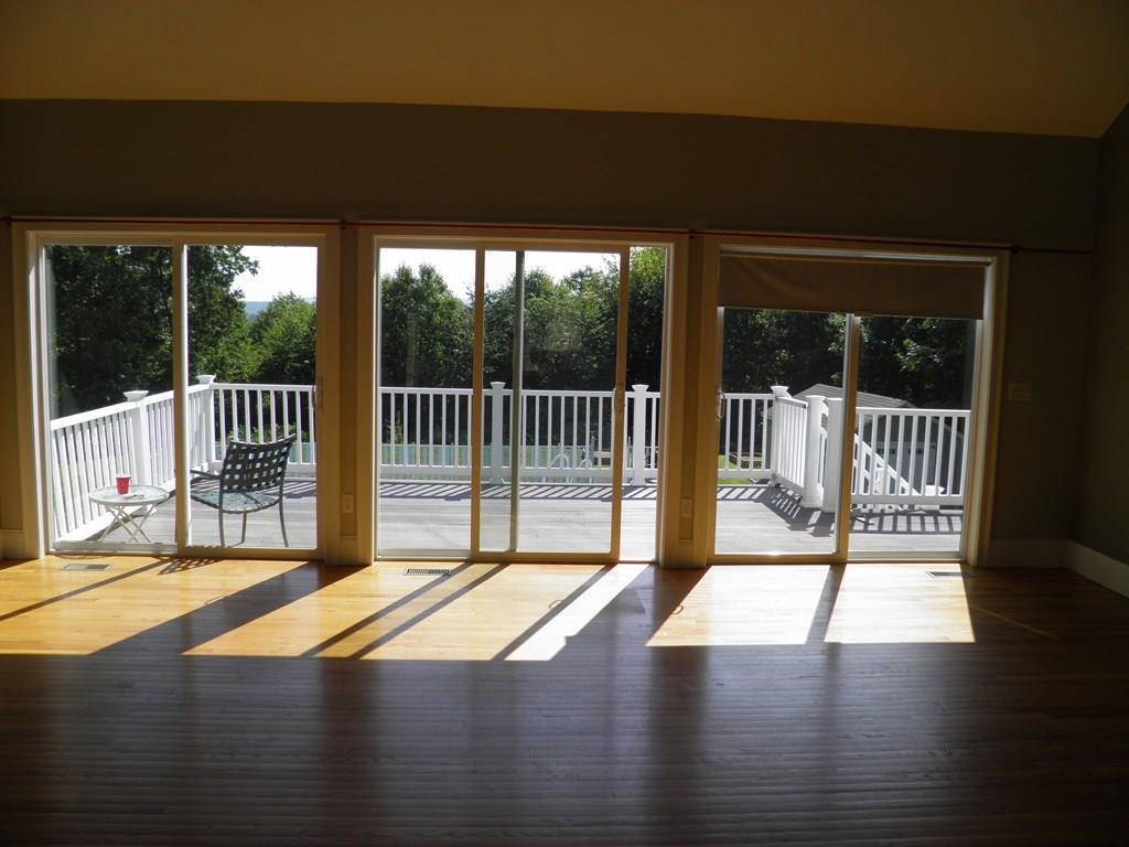115 Fisherdick Road Ware, MA 01082 - Photo 8 of 30 a view of a balcony with a floor to ceiling window
