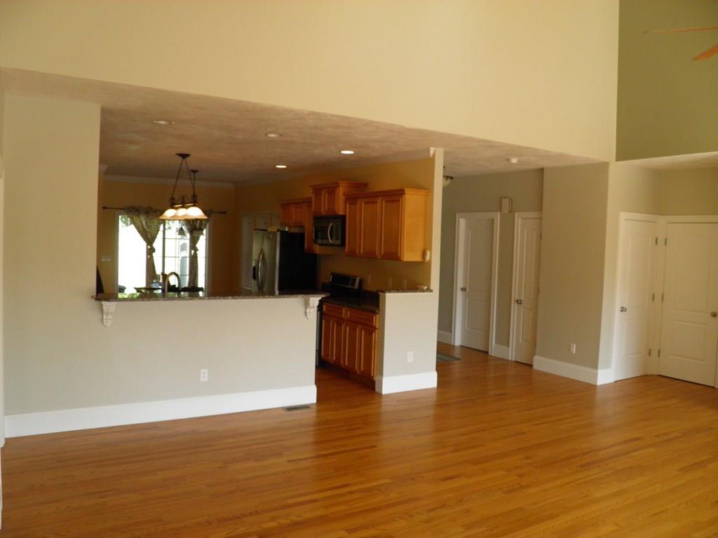 115 Fisherdick Road Ware, MA 01082 - Photo 9 of 30 a view of a kitchen with kitchen island wooden floor and entryway