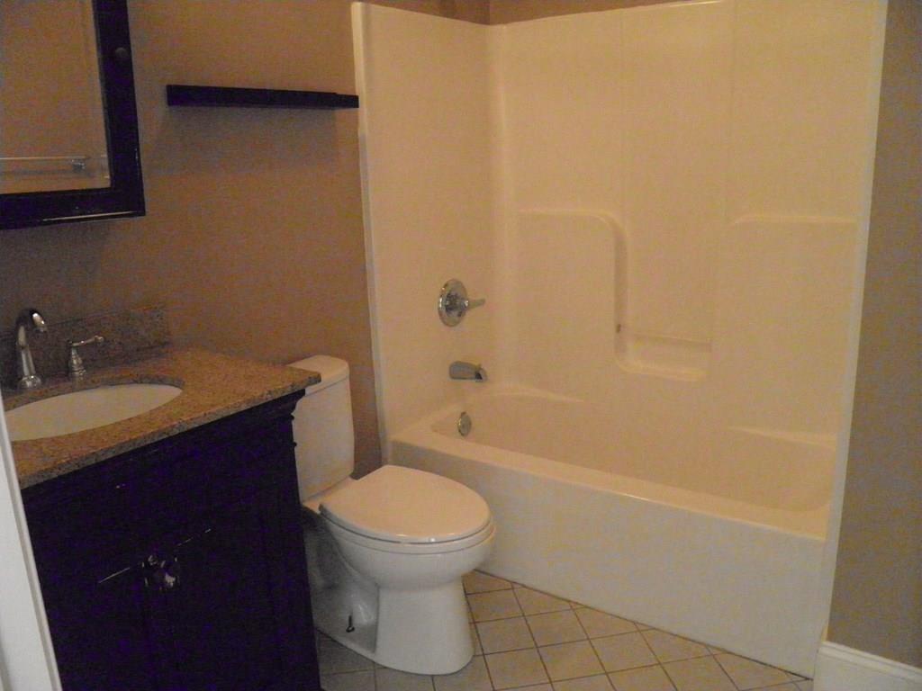 115 Fisherdick Road Ware, MA 01082 - Photo 10 of 30 a bathroom with a sink a toilet and shower