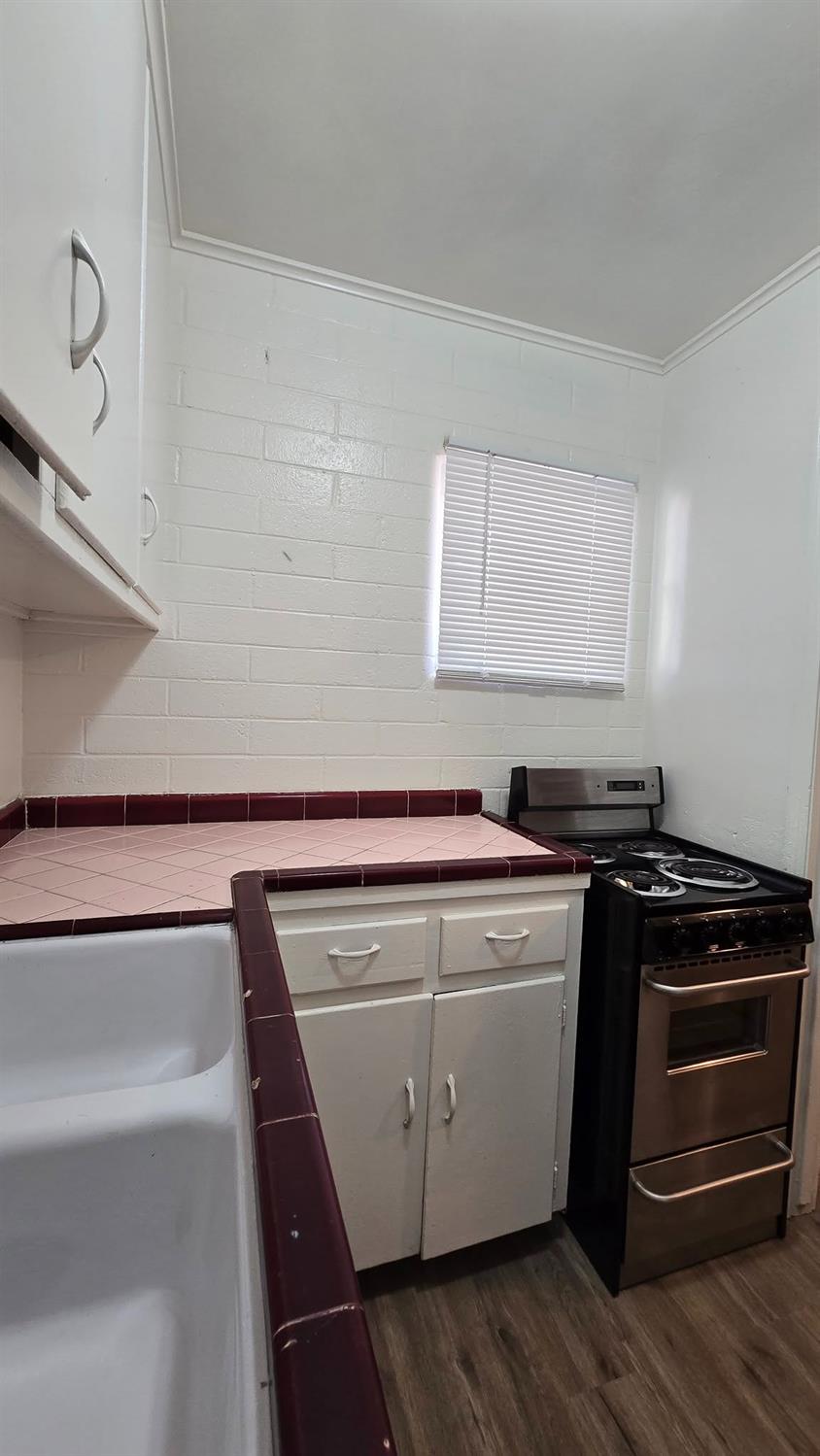 3335 East Normal Avenue Fresno, CA 93703 - Photo 5 of 9 a utility room with washer and dryer