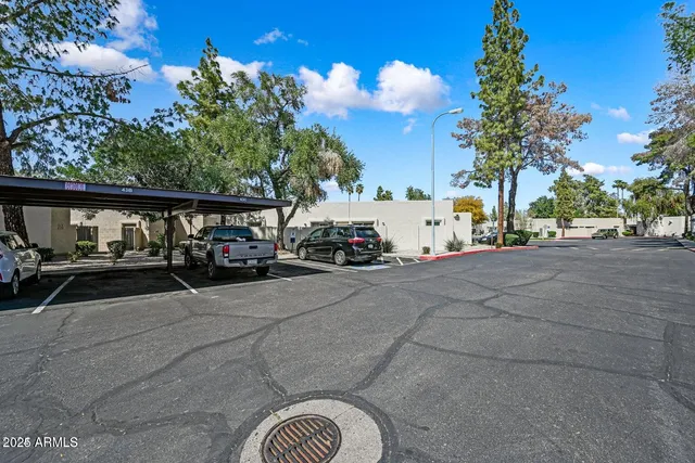a view of street with parked cars
