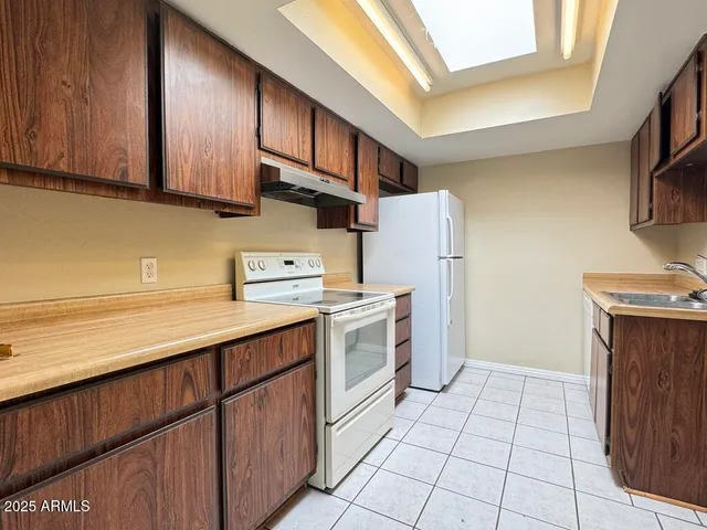 a view of an empty room and a window