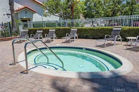 a view of a swimming pool with a patio
