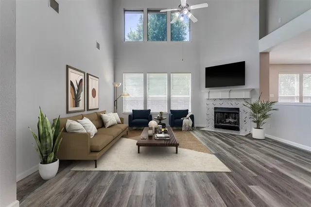 a living room with furniture and a fireplace