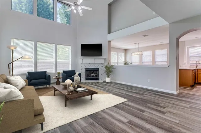 a living room with furniture fireplace and a flat screen tv