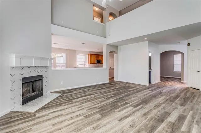 a view of an empty room and fire place