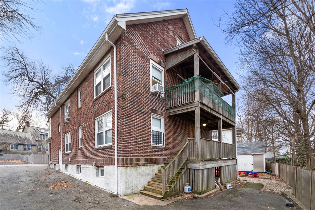 113-115 Nottinghill Road Boston, MA 02135 - Photo 2 of 12 a view of a house with a yard