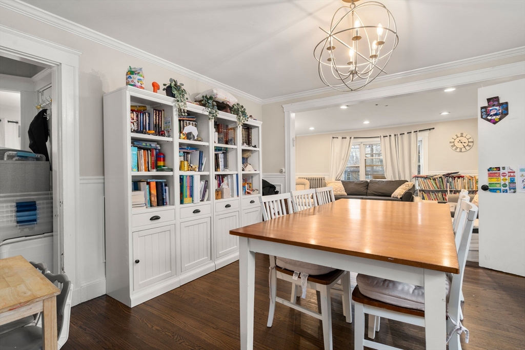 113-115 Nottinghill Road Boston, MA 02135 - Photo 3 of 12 a view of a dining room with furniture and wooden floor