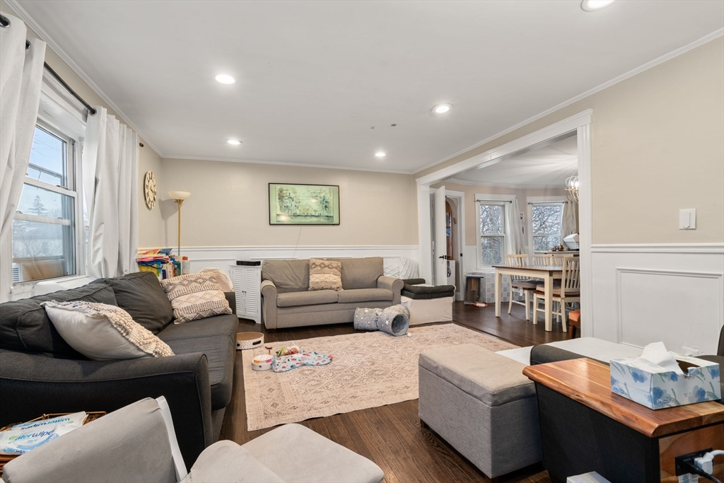 113-115 Nottinghill Road Boston, MA 02135 - Photo 4 of 12 a living room with furniture and a table