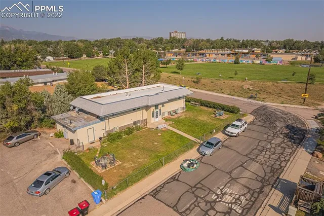 an aerial view of a house with a ocean view