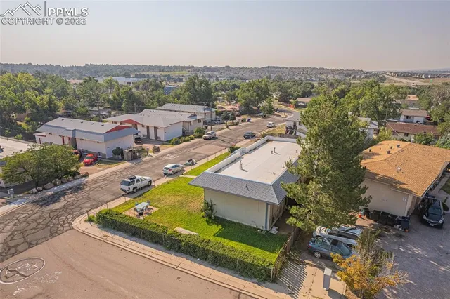 an aerial view of a house with a garden