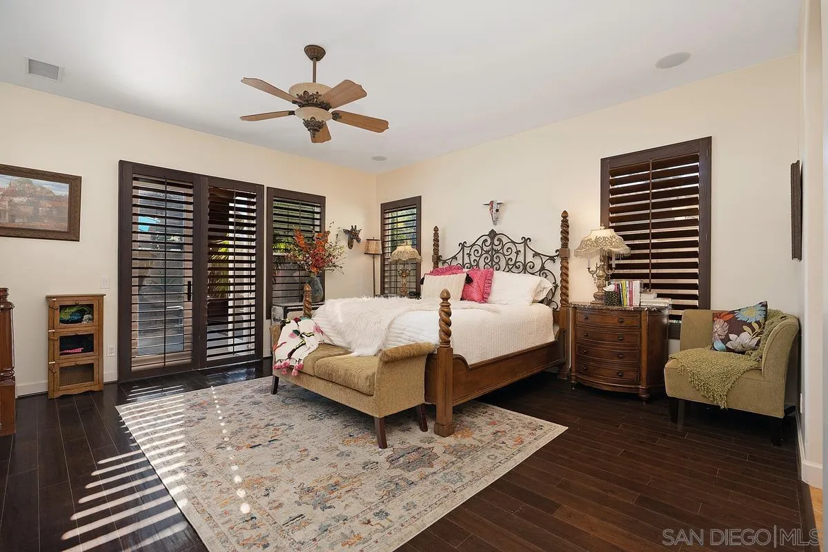 14779 Rio Rancho San Diego, CA 92127 - Photo 20 of 35 a bedroom with a bed and wooden floor