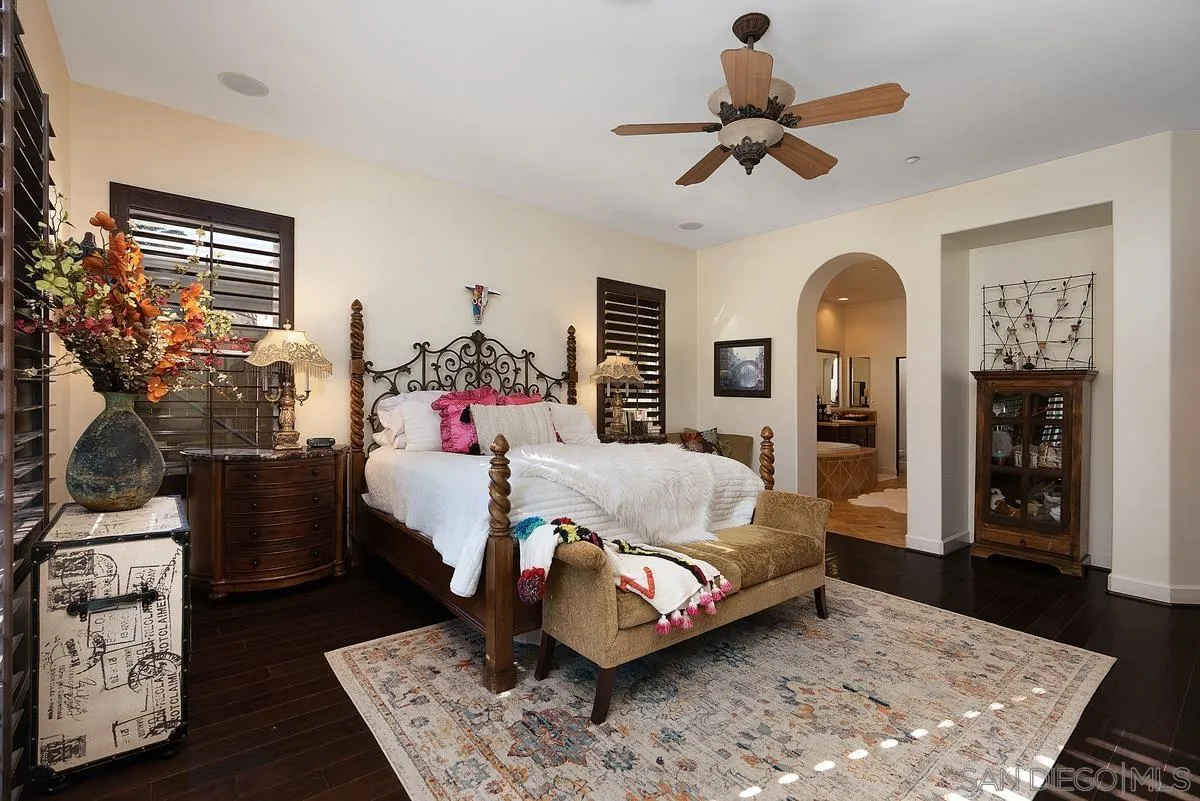 14779 Rio Rancho San Diego, CA 92127 - Photo 22 of 35 a bed room with a bed window and a couch