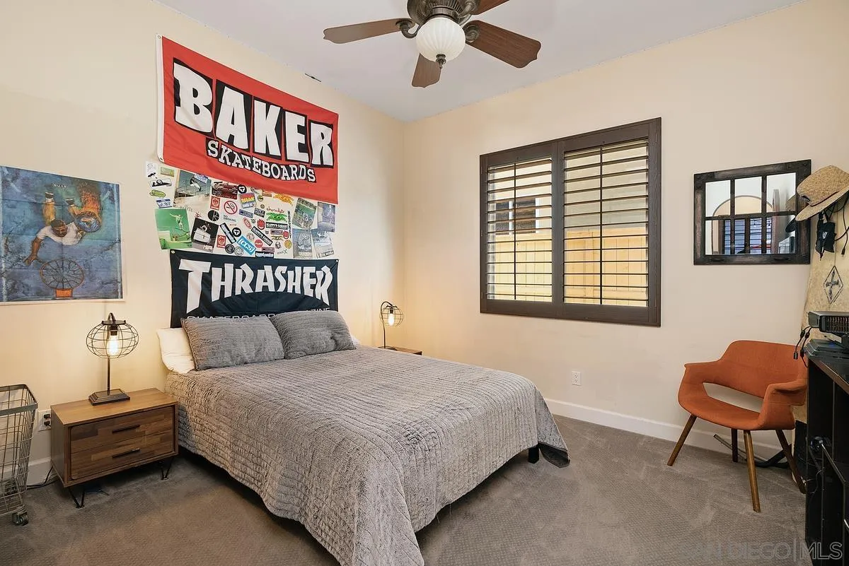 14779 Rio Rancho San Diego, CA 92127 - Photo 29 of 35 a bedroom with a bed and a chandelier