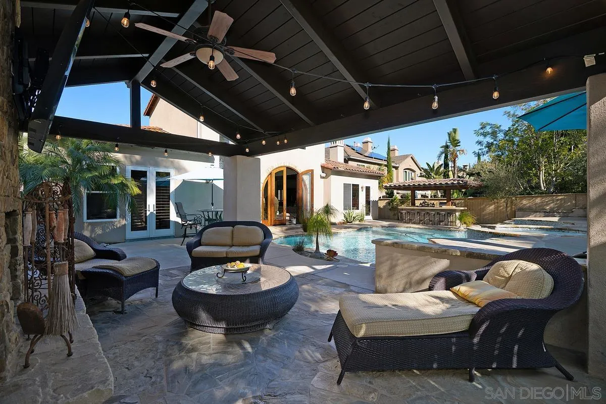 14779 Rio Rancho San Diego, CA 92127 - Photo 34 of 35 a living room with patio furniture and a potted plant
