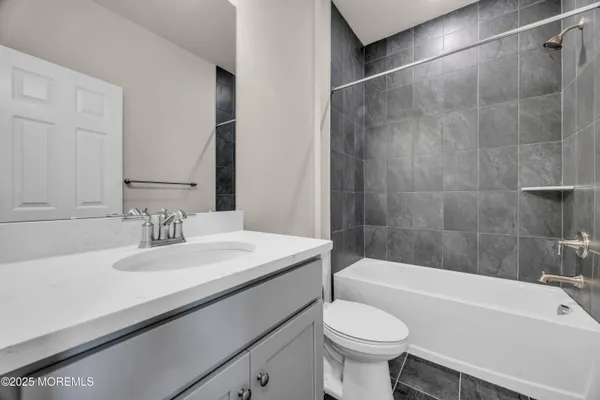 a bathroom with a sink a toilet and a bathtub