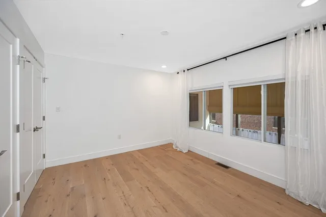 a view of empty room with windows