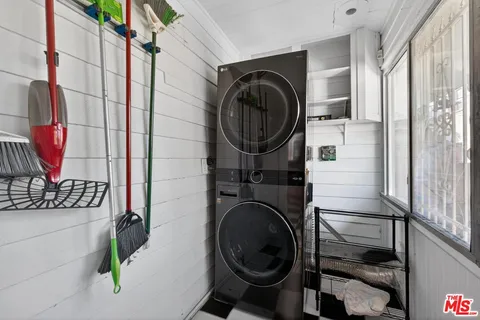 a view of a house with backyard porch and sitting area