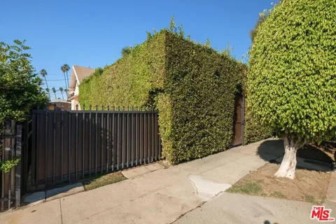 an aerial view of multiple houses with yard