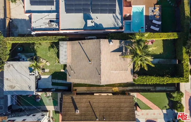 a picture of a bench in front of a white house