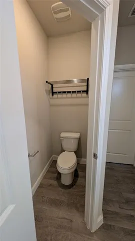 a bathroom with a granite countertop sink toilet a mirror and bathtub