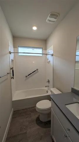 a view of empty room with a fireplace