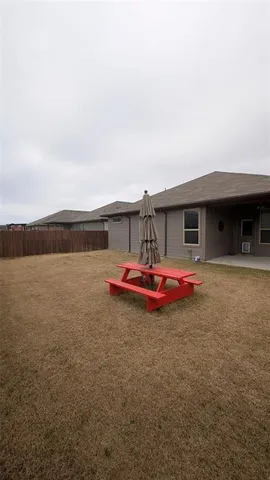 a aerial view of a house with a yard